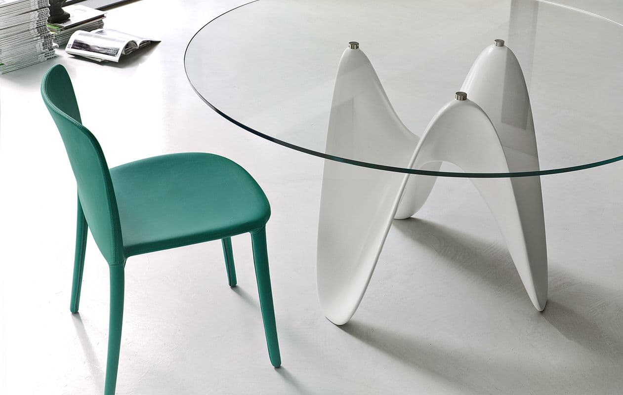 GAYA is an innovative table with solid surface base and circular tempered glass top, inspired by the algorithm of three-dimensional waves: the structure of the base with an organic profile is made by molding in Tecnoril®, a new generation acrylic stone strictly 100% made in Italy, which guarantees high resistance and quality