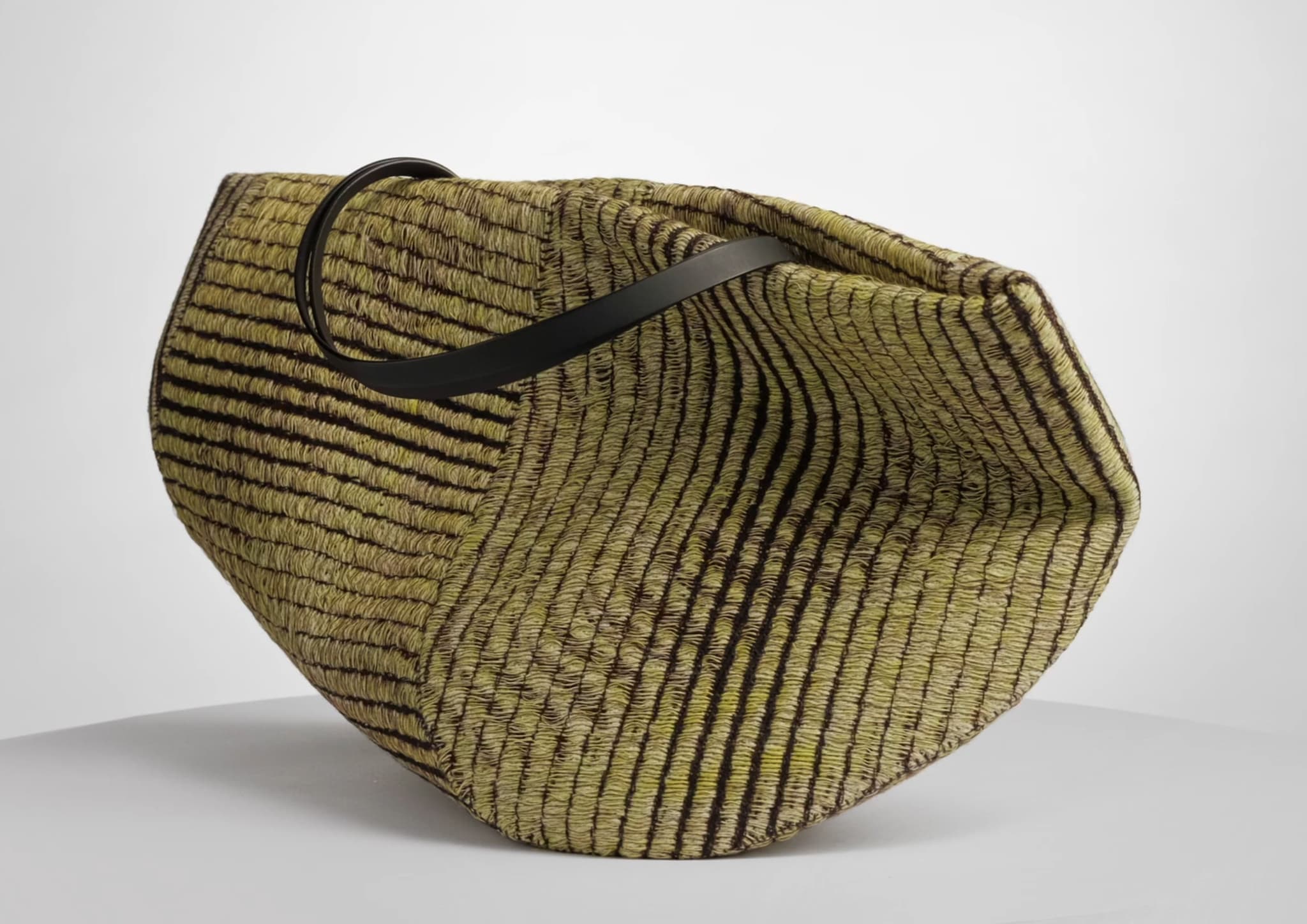 Bag made with jacquard woven textile, woven at the weaving mill Innvik in Norway by Vevft. The textile is part of a bigger collaboration project with bag designer Matilda Venczel
