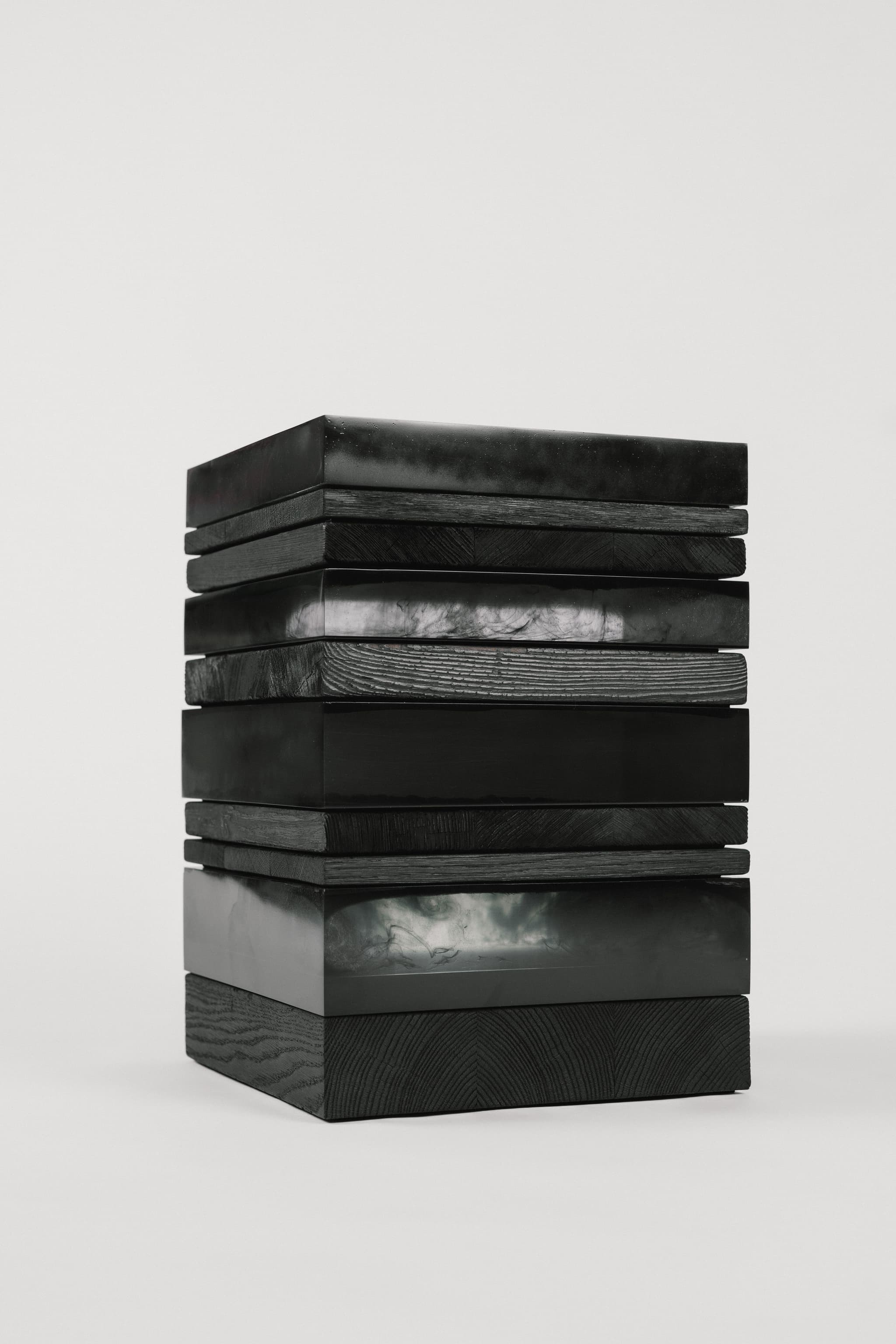Side table, cast resin & burnt wood - Introduced at Milan Design Week 2024 (Photo credit: @P.H.I. Interior)