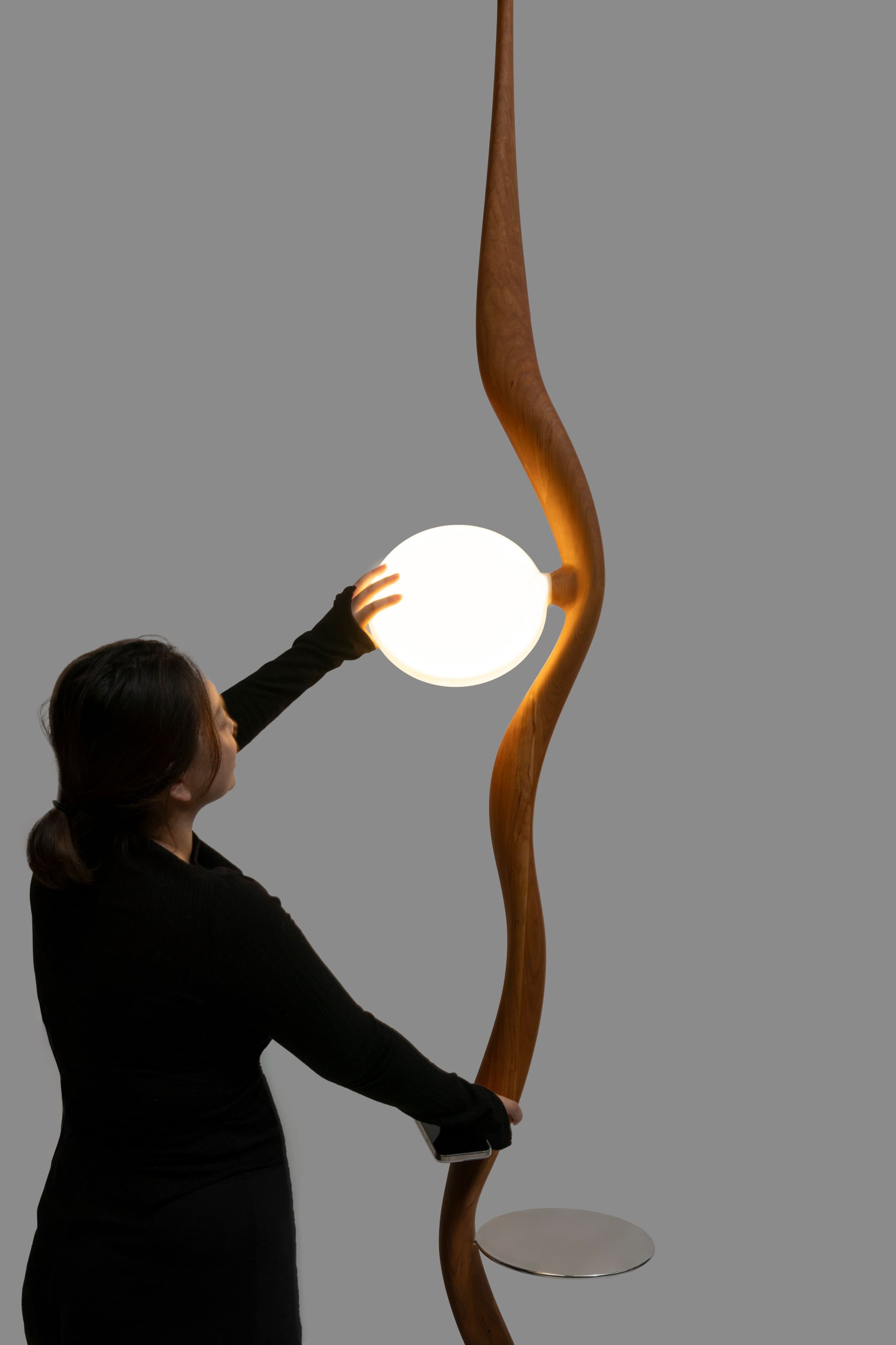 Yiting Hou and her lamp "Moonshadow"(Photo credit: @Yiting (Erin) Hou)