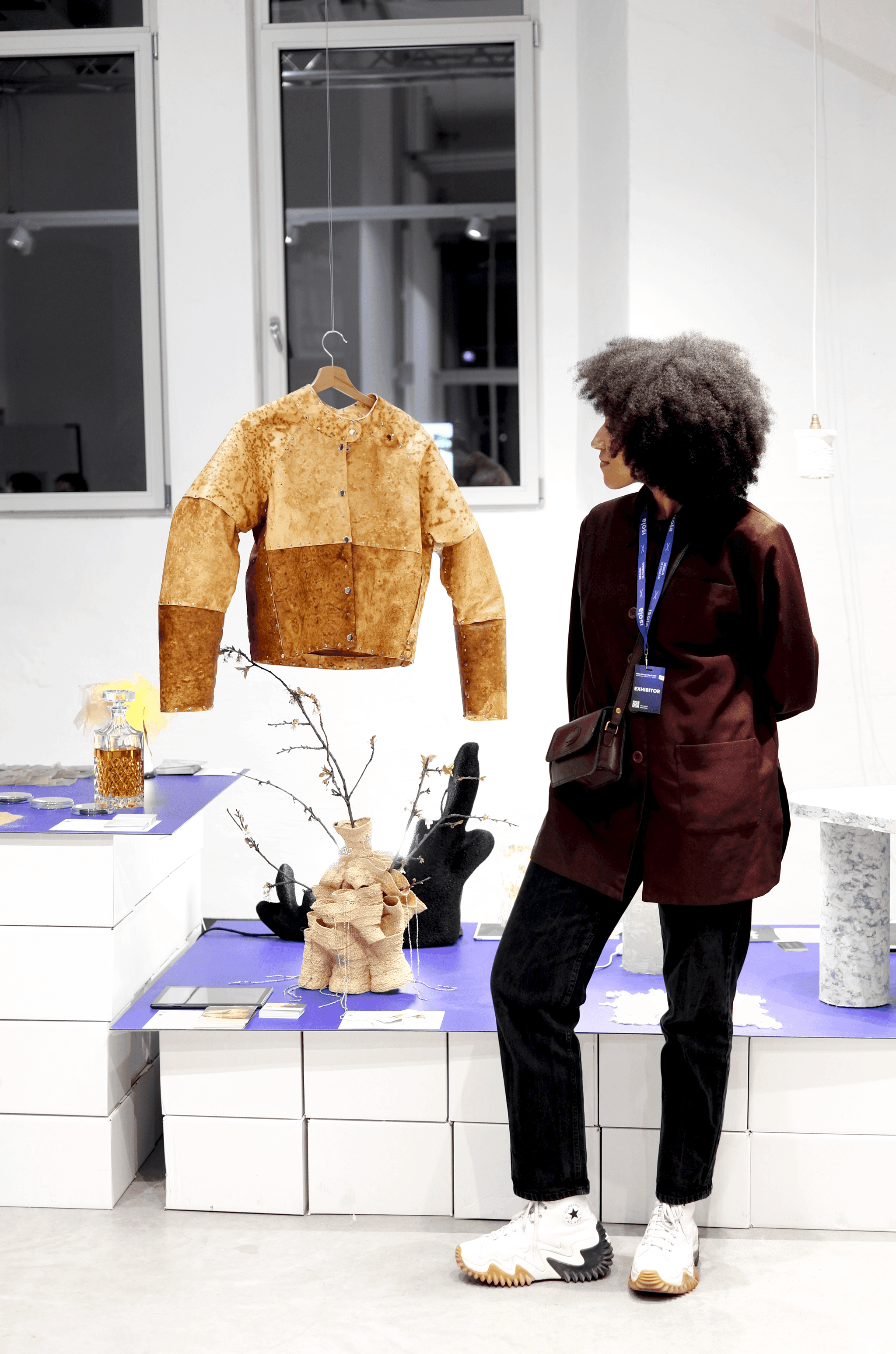 Designer Annah-Ololade Sangosanya with her jacket made of mycelium skins, “Fungal skins: macro” at the Isola Design Festival